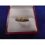 Yellow coloured metal ring set with 5 graduated diamonds, unmarked, Size J with leather bound ring