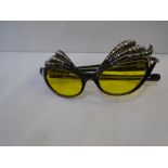 Pair of vintage French Cat Eye sunglasses, black plastic frames with diamante and star decoration,