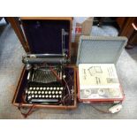 A folding corona typewriter in leather case and a vintage pye portable radio