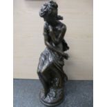 After Moreau; a bronze resin sculpture of a semi nude classical lady seated on a stump. 64 cm