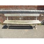 A Victorian cast iron bench with later teak slots, 159cms.