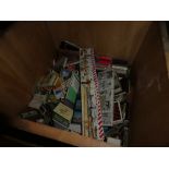 Wooden bucket containing vintage matchboxes