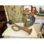 Vintage brass signalling lamp and a brass taxi horn