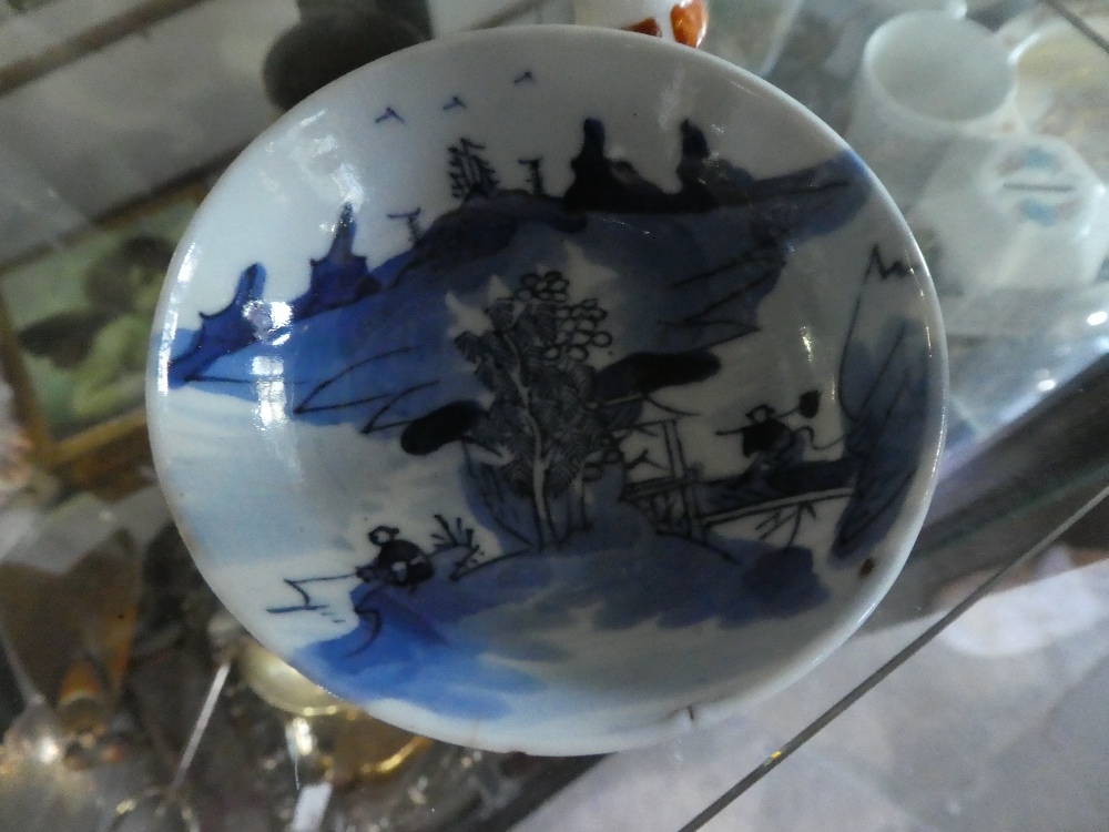 Small blue and white Oriental dish with markings to base