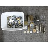 A silver Va case, three American coins, a quantity of military buttons and sundry.