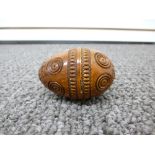 An old Carved wood egg shaped nutmeg grater