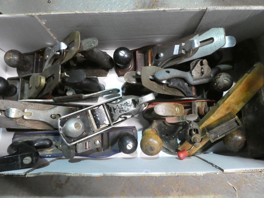 Box of old and modern wood planes.