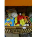 Wicker basket containing collect Rupert The Bear memorabilia to include soft toys, albums and books