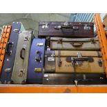 Five vintage suitcases together with wooden handled box