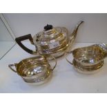 George V silver 3 piece tea set comprising teapot with ebony knop and handle, sugar basin and milk