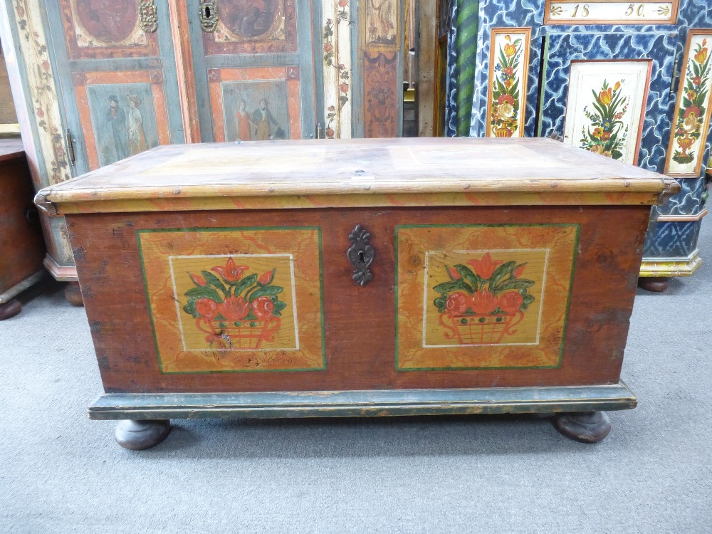 A 19th century painted European Coffer, a hinged top above base painted with square panels of