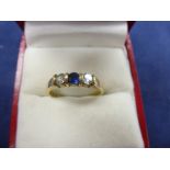 9ct yellow gold ring set with 2 diamonds and central sapphire, shank stamped 375 size N/O