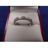 White coloured metal full eternity ring set with diamonds, unmarked, size R/S