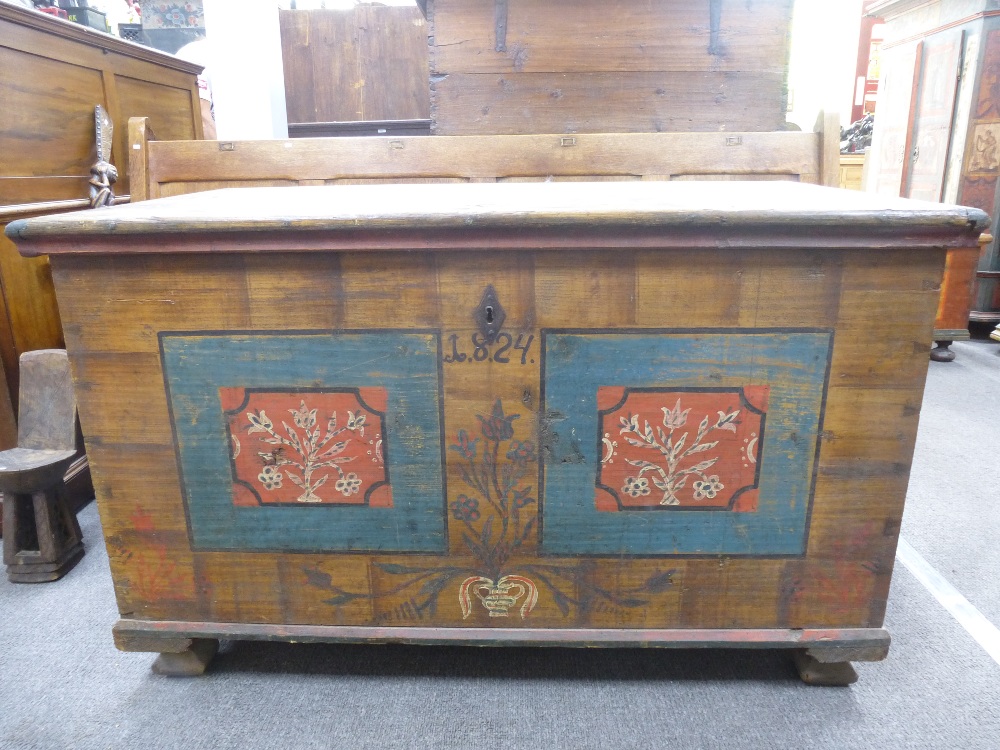 A 19th century painted European Coffer, dated 1824, the hinged top above a base painted with