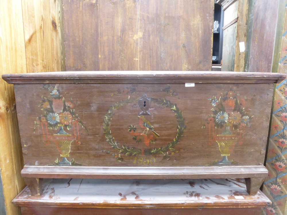 A large 19th century painted European Coffer, dated 1830, the hinged top above a base painted with a