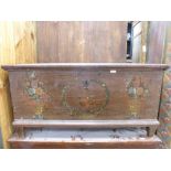 A large 19th century painted European Coffer, dated 1830, the hinged top above a base painted with a