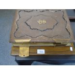 A Victorian leather photograph album and a cased set of plated cutlery