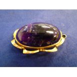 Cabochon oval amethyst pendant/brooch with 9ct rose gold mount, 5 x 3 cm, gross item weight 17.9g