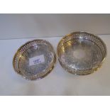 Pair of silver bottle coasters with pierced edges, engraved leaf and flower decoration, stamped