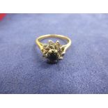Sapphire and diamond cluster ring on an 18ct gold shank stamped 18ct, size M/N, gross item weight