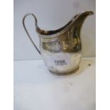 George III silver cream jug with reeded edges. bounded bight cut decoration, London 1800, makers