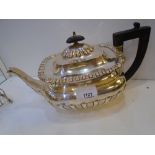 Edwardian silver teapot with half gadroon decoration, ebony knop and handle, London 1908, maker's