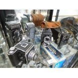 Two Rolleiflex box cameras, a Reflex - Korelle camera and two others