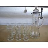 A large German glass jug having pewter mounts, A/F and a set of 6 matching glasses.