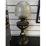 Metal oil lamp with glass decorative etched shade.