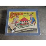 Bayko building set and a vintage shooting toy.