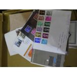 A box containing first day covers, stamp albums.