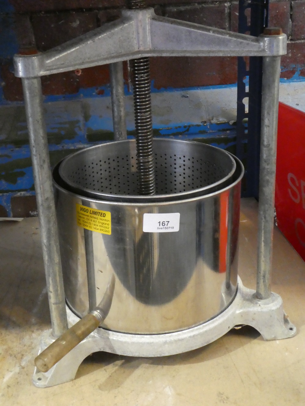 A small metal apple press