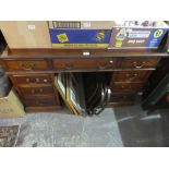 Mahogany roll top desk with fitted interior above 9 drawers