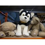 Three large stuffed toys, two bears and a dog
