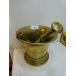 Heavy bronze mortar and ple 14cm high and a smaller bronze ple