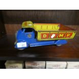 A vintage tin plate dump truck marked Lumar Construction Company