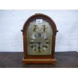A Victorian oak mantel clock with Wminster chime with silvered dial