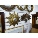 Two 20th century gilt convex starburst mirror, the larg 63cms.