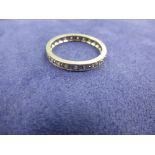 White coloured metal full eternity ring set with diamonds, unmarked, size R/S