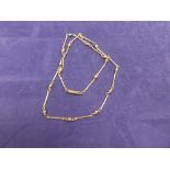 9ct yellow gold necklace with ball spacers marked 9ct, 23cm long, 5.8g