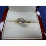Pretty Edwardian double flower diamond ring on a yellow coloured metal shank, size P, unmarked,