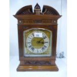 A Victorian walnut bracket clock 8 day chinning on hour and a half hour with brass face 33cms.