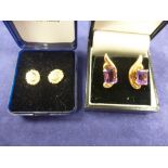 Pair of yellow coloured metal ear studs inset with amethyst, butterfly backs stamped 750. Total