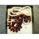 Long cultured pearl necklace, 70cm long & a red bead necklace