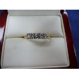 Five stone natural diamond ring on an 18ct yellow and white gold shank, stamped 750, total imated