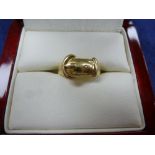 18ct yellow gold buckle style ring, stamped 18, maker A.M&C, sixe M 4.5g