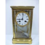 A gilt glass mantle clock probably French 25.5cms.