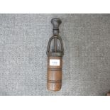 A vintage iron and wood bottle corker probably French