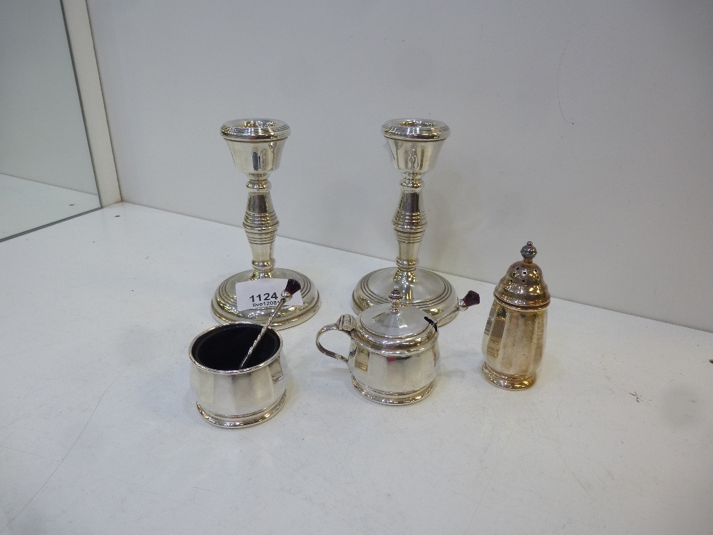 Pair of salts, silver pepper pot and a pair of silver candle sticks, total approx 2 troy oz