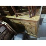 Waxed pine desk with 7 drawers and a recessed cupboard